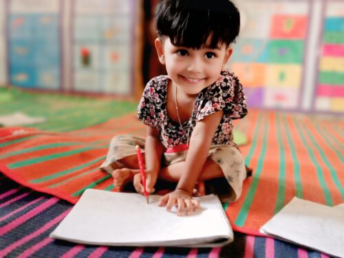 Dil Keyas, writing in her drawing book. Photo by Ata