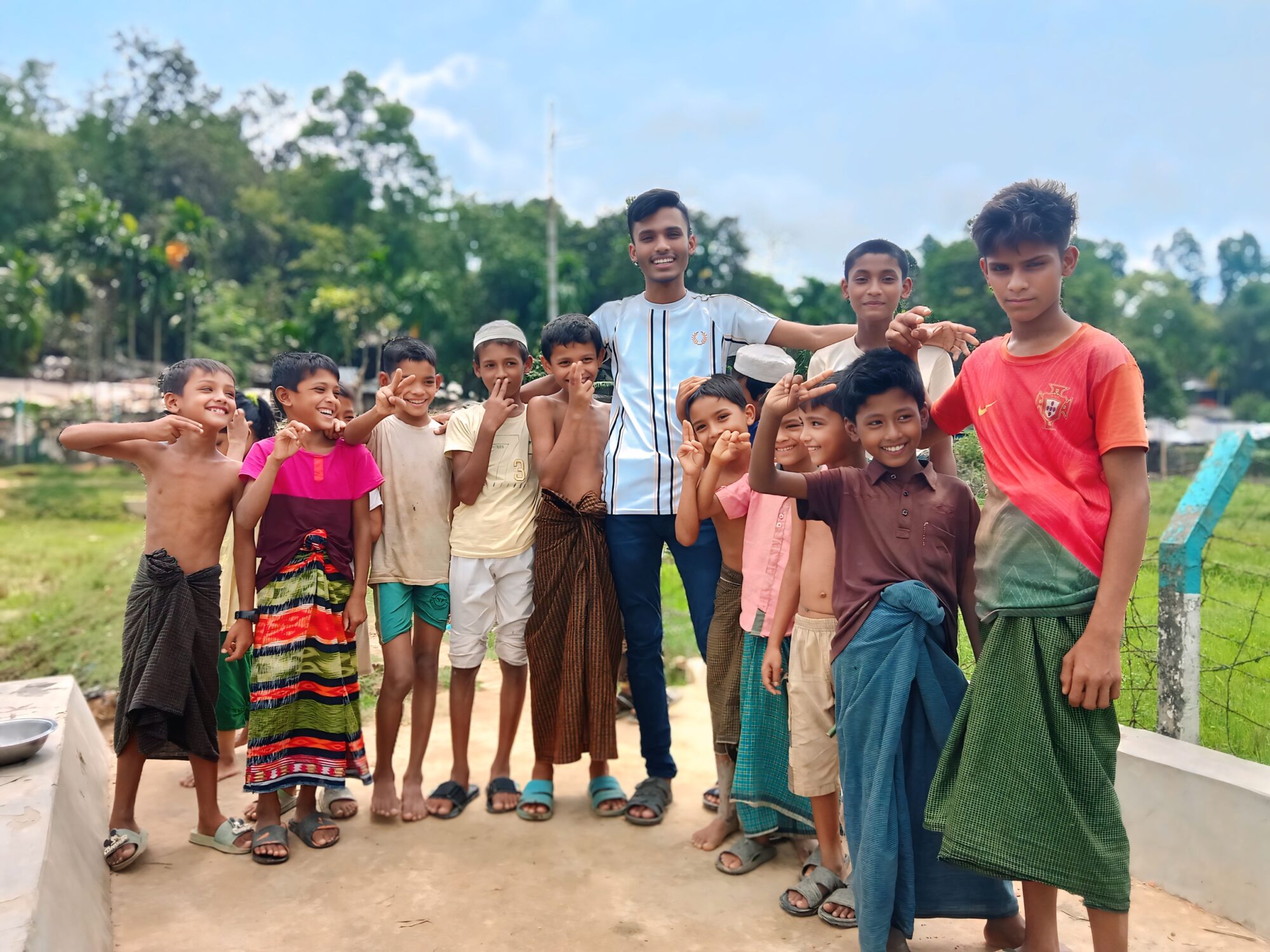 A group of young people Ata interviewed. These boys smiled brightly when I met them in the camp. But behind their smiles is a question: ‘When can we go back to school?’ Photo by Ata