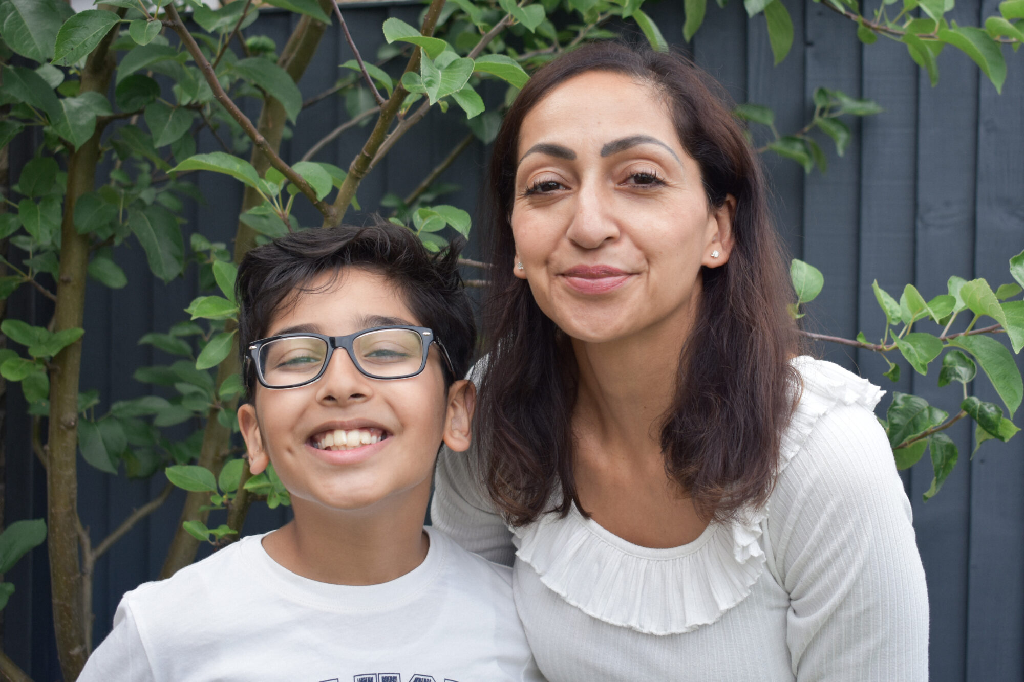 Umar and his mother, Fozia, in their back garden