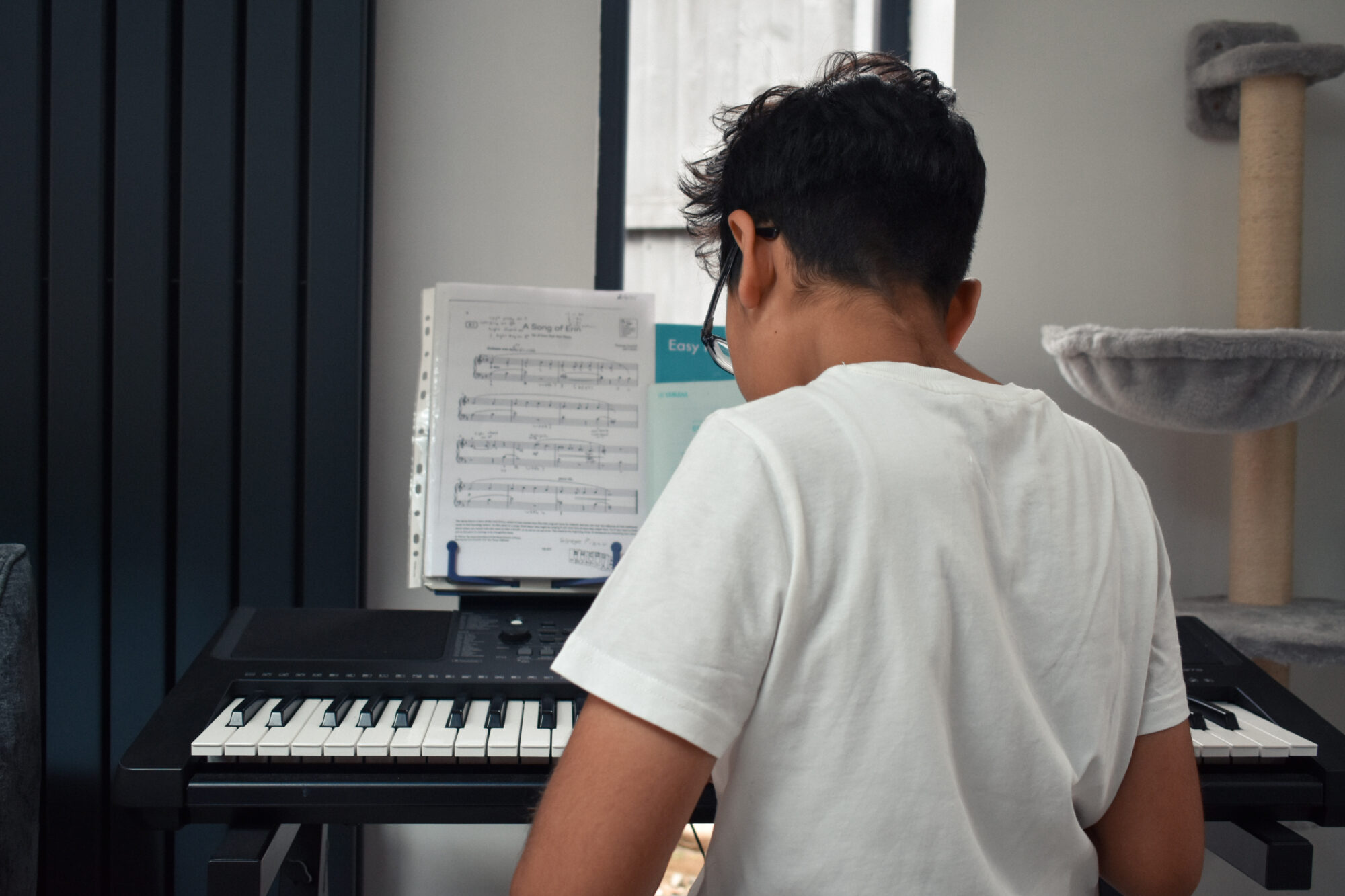 Umar showing Imani what he’d learnt in his piano lessons