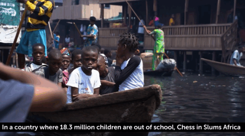 Screenshot of Victory's video showing children on a canal boat from 'How Chess Changed The Lives Of Slum Children'