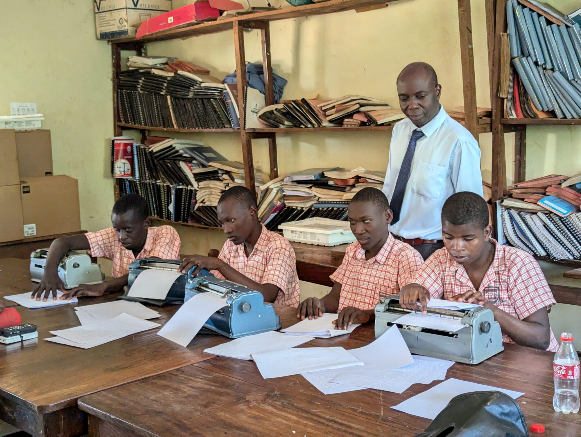 Visually impaired students at Bishop Willis Demonstration Primary School using braille to read and learn