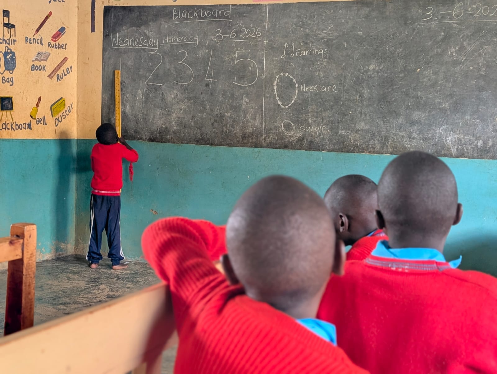 A learner at Ngarenaro Special School helps take his fellow classmates through a numbers lesson, as guided by their teacher