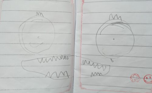 One big Fanged Creature drawn in the middle of a school notebook, with round eyes and big Fanged jaw, Lia drew this a lot as if she was trying to make sense of it, Dr.Walaa is giving her smile and star stamp at the bottom to encourage her to express herself more.