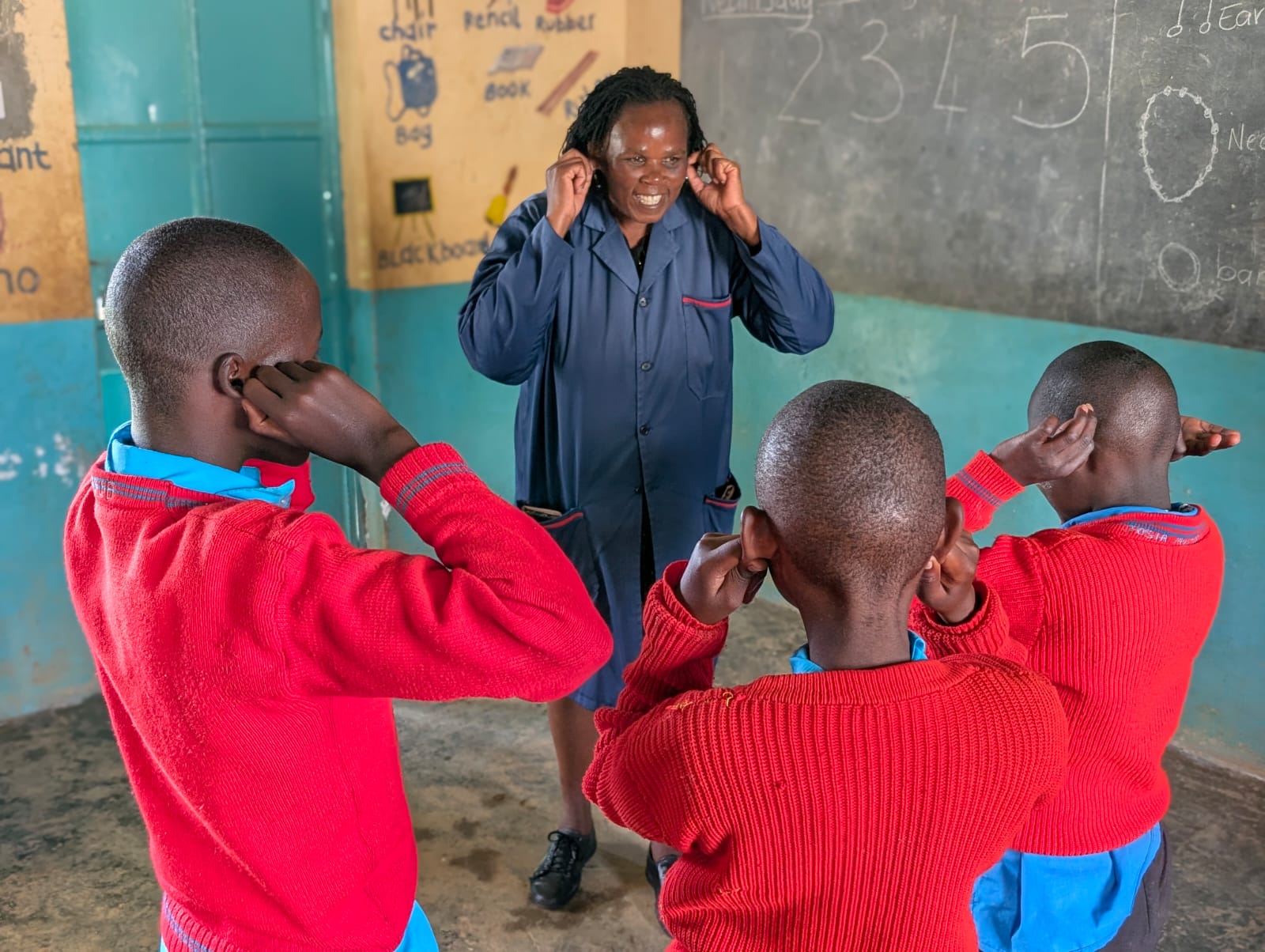 A teacher involves learners through a class on the parts of the body.
